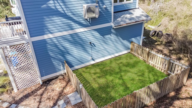 view of home's exterior featuring ac unit, a yard, and a fenced backyard