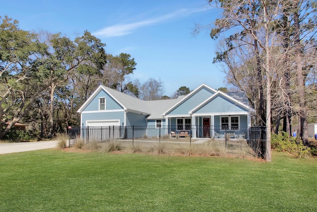 view of front of house featuring a front yard, an attached garage, driveway, and a fenced front yard