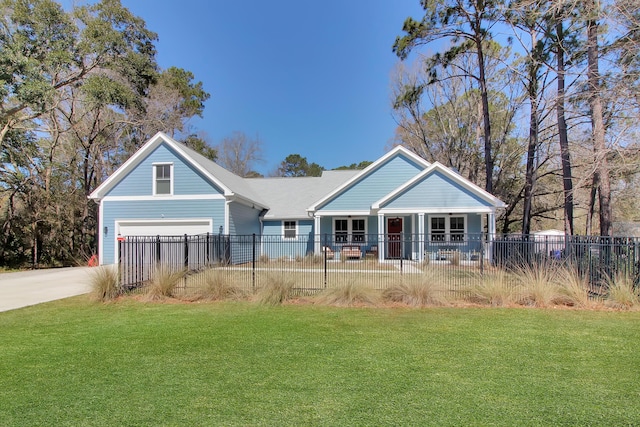 view of front facade with a fenced front yard, driveway, and a front lawn