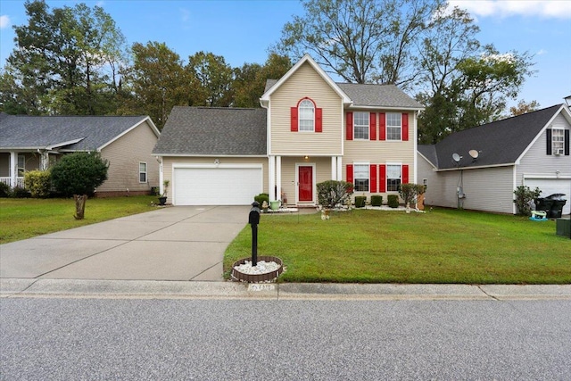 view of front of property featuring a front yard and a garage