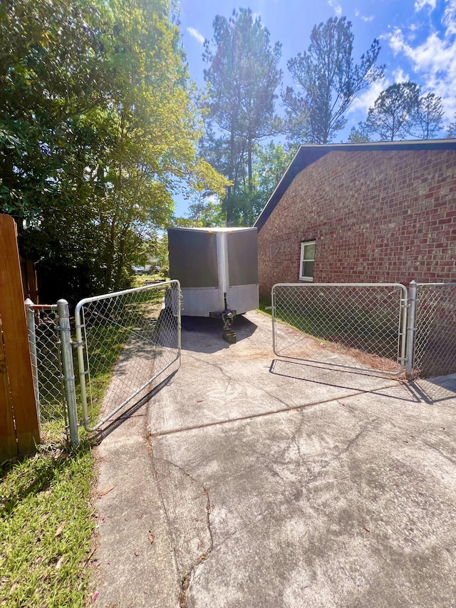 view of home's community featuring fence and a gate