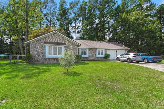 ranch-style house with a garage and a front lawn