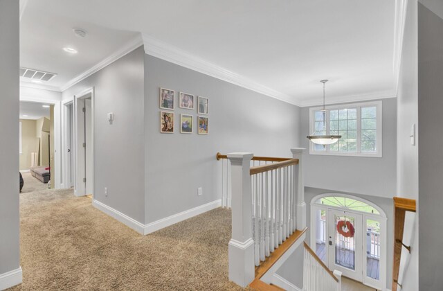 hallway featuring an upstairs landing, carpet, ornamental molding, baseboards, and recessed lighting