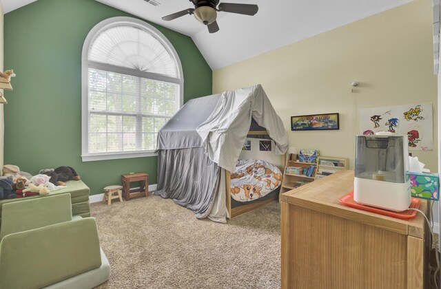 carpeted bedroom featuring vaulted ceiling, a ceiling fan, and baseboards