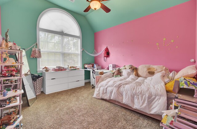 bedroom featuring lofted ceiling, carpet flooring, and a ceiling fan