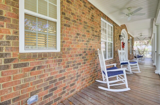 deck featuring a porch and a ceiling fan