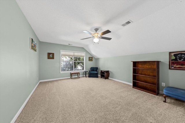 1330 Somersby Ln, Mount Pleasant, SC 29466 - sitting room with a textured ceiling, a ceiling fan, carpet floors, baseboards, and vaulted ceiling