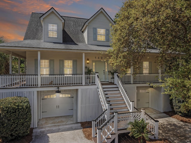 1491 Greenshade Way, Mount Pleasant, SC 29464 - view of front of house with covered porch, stairway, an attached garage, concrete driveway, and roof with shingles