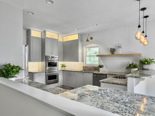 1491 Greenshade Way, Mount Pleasant, SC 29464 - kitchen with appliances with stainless steel finishes, a sink, light stone counters, pendant lighting, and recessed lighting