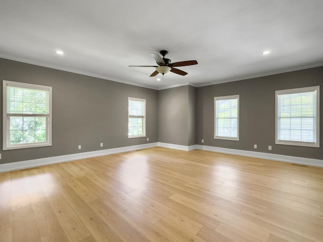 1491 Greenshade Way, Mount Pleasant, SC 29464 - empty room featuring ceiling fan, baseboards, light wood finished floors, crown molding, and recessed lighting