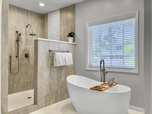 1491 Greenshade Way, Mount Pleasant, SC 29464 - bathroom with a freestanding bath, a walk in shower, baseboards, and recessed lighting