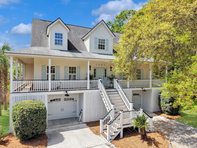 1491 Greenshade Way, Mount Pleasant, SC 29464 - coastal home with an attached garage, driveway, covered porch, stairway, and a shingled roof