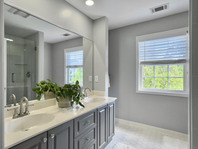 1491 Greenshade Way, Mount Pleasant, SC 29464 - bathroom featuring double vanity, a stall shower, tile patterned flooring, and baseboards
