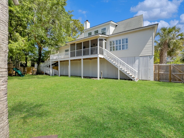 1491 Greenshade Way, Mount Pleasant, SC 29464 - back of property with a sunroom, stairs, and a chimney