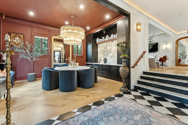 bar featuring arched walkways, recessed lighting, a decorative wall, stairs, and ornamental molding