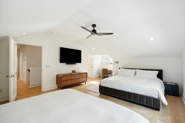 bedroom with a ceiling fan, lofted ceiling, light wood finished floors, and recessed lighting