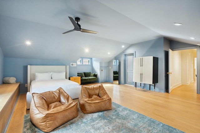 bedroom with vaulted ceiling, wood finished floors, a ceiling fan, and recessed lighting