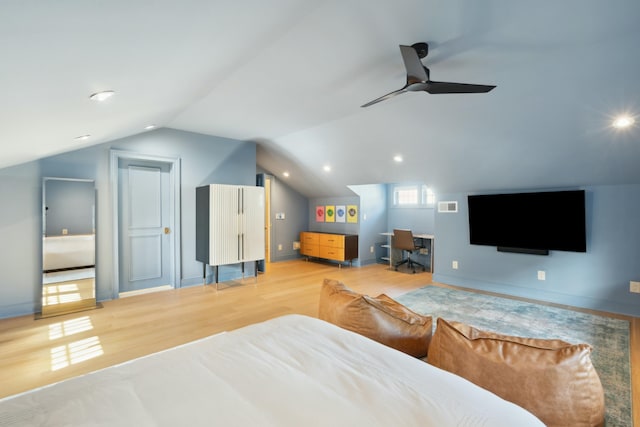 bedroom with lofted ceiling, ceiling fan, light wood-type flooring, and baseboards