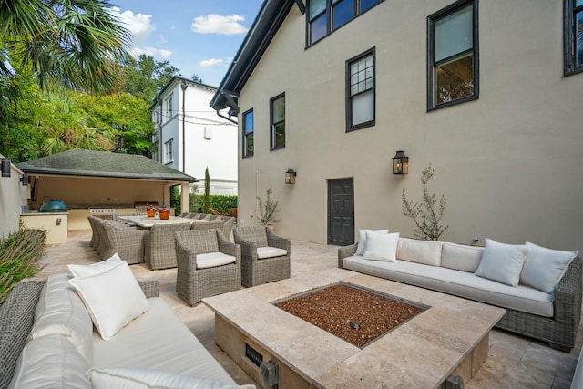 view of patio featuring outdoor dining area, outdoor lounge area, and exterior kitchen