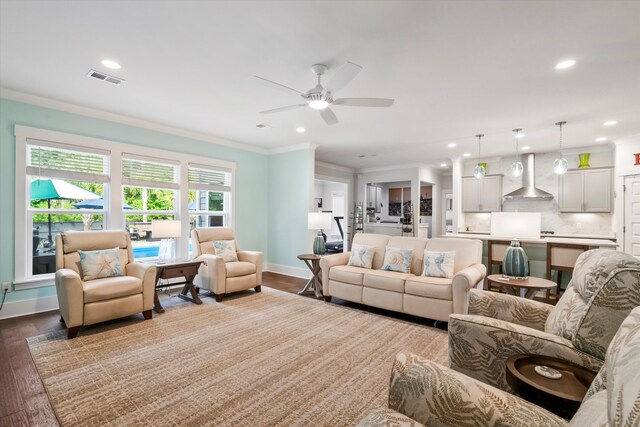2331 Brinkley Rd, Johns Island, SC 29455 - living area with crown molding, ceiling fan, dark wood-style flooring, and recessed lighting