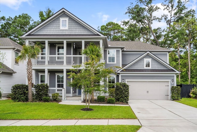2331 Brinkley Rd, Johns Island, SC 29455 - view of front of home featuring a balcony, covered porch, concrete driveway, and a front yard