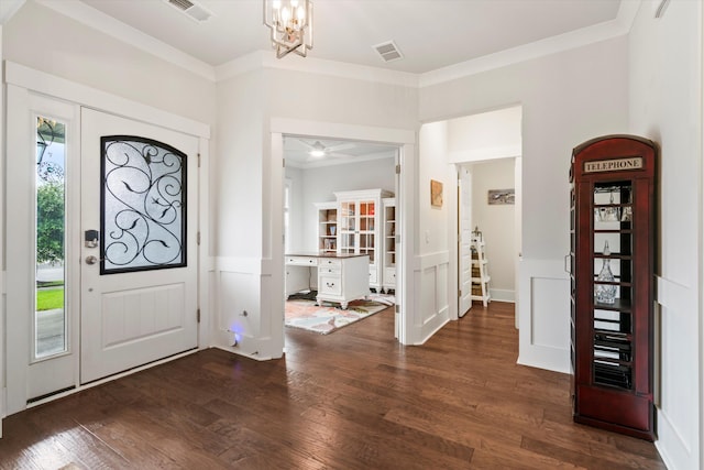 2331 Brinkley Rd, Johns Island, SC 29455 - entryway featuring crown molding, wood finished floors, and a chandelier