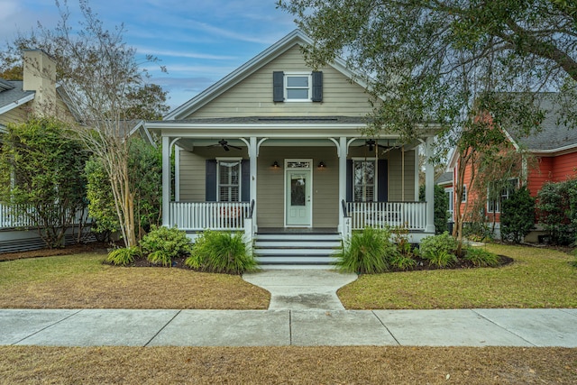 bungalow-style house featuring a front lawn