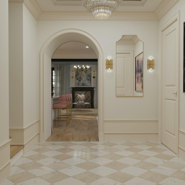 8 Homel Pl, Charleston, SC 29403 - corridor featuring arched walkways, a decorative wall, an inviting chandelier, and ornamental molding