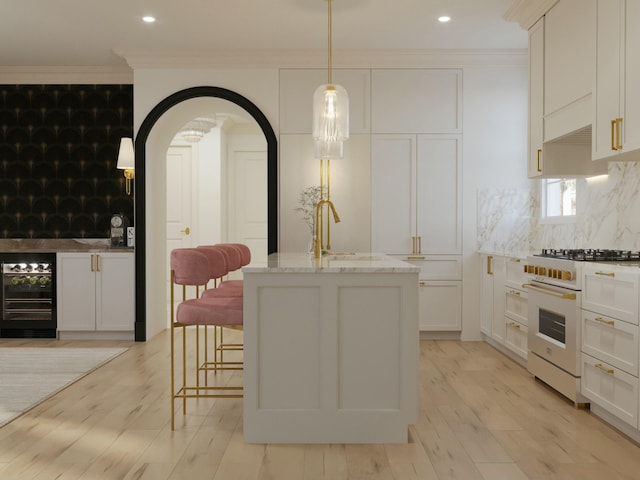 8 Homel Pl, Charleston, SC 29403 - kitchen with tasteful backsplash, crown molding, white range with gas stovetop, light stone countertops, and beverage cooler