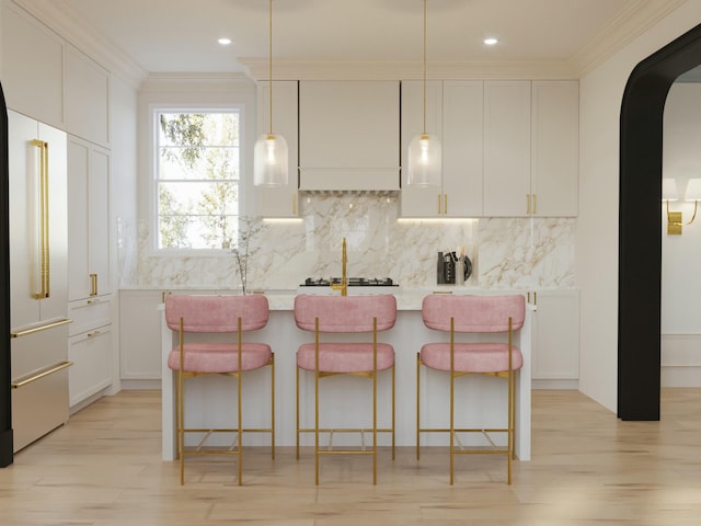 8 Homel Pl, Charleston, SC 29403 - kitchen with arched walkways, custom range hood, a center island with sink, decorative backsplash, and high end fridge