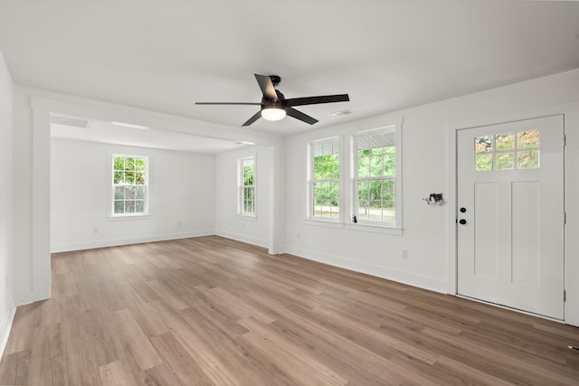 foyer with ceiling fan and light wood-type flooring