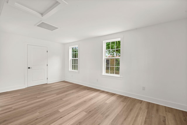 empty room with light hardwood / wood-style flooring