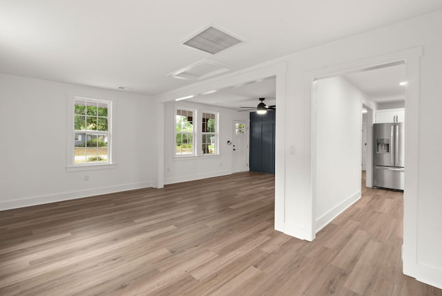 unfurnished living room featuring light hardwood / wood-style flooring