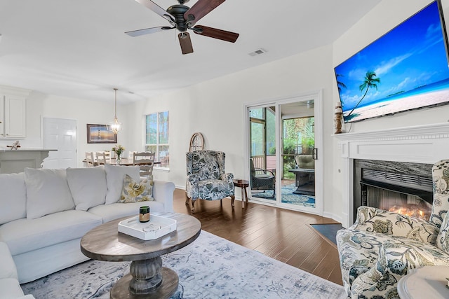 2467 Bergeron Way, Mount Pleasant, SC 29466 - living room featuring wood finished floors, plenty of natural light, a ceiling fan, and a fireplace with flush hearth