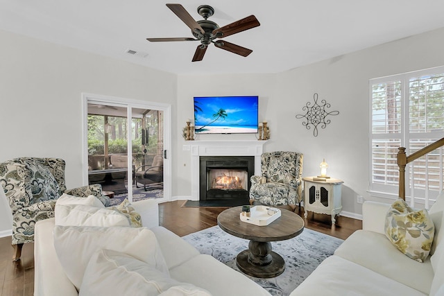 2467 Bergeron Way, Mount Pleasant, SC 29466 - living area featuring healthy amount of natural light, wood finished floors, a fireplace with flush hearth, and a ceiling fan