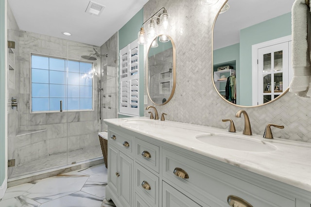 2467 Bergeron Way, Mount Pleasant, SC 29466 - bathroom featuring a stall shower, double vanity, marble look tiles, and backsplash