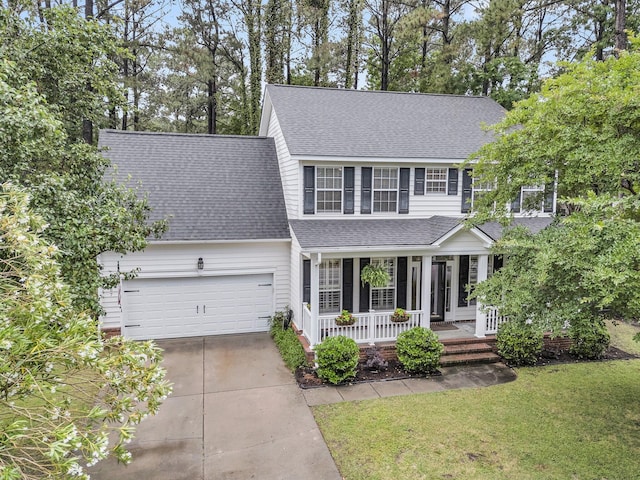 2467 Bergeron Way, Mount Pleasant, SC 29466 - traditional home featuring a porch, roof with shingles, driveway, a front yard, and a garage