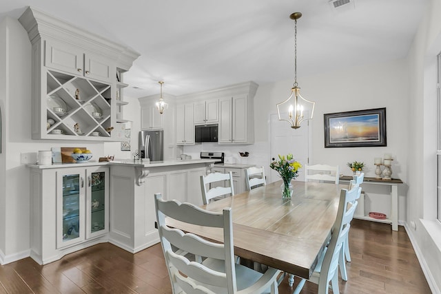 2467 Bergeron Way, Mount Pleasant, SC 29466 - dining area featuring a chandelier, dark wood finished floors, and baseboards