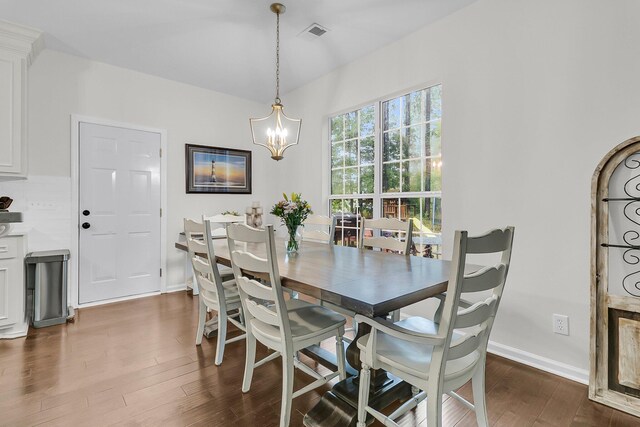 2467 Bergeron Way, Mount Pleasant, SC 29466 - dining room with dark wood-style floors, a chandelier, and baseboards