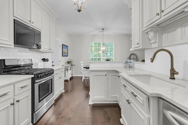2467 Bergeron Way, Mount Pleasant, SC 29466 - kitchen featuring stainless steel appliances, a sink, white cabinetry, dark wood-style flooring, and decorative backsplash