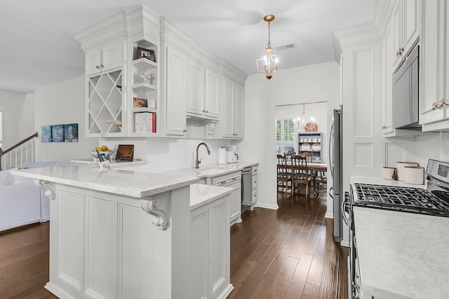 2467 Bergeron Way, Mount Pleasant, SC 29466 - kitchen featuring appliances with stainless steel finishes, white cabinets, a peninsula, a sink, and dark wood-style floors