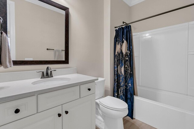 bathroom featuring wood finished floors, toilet, vanity, and shower / bathtub combination with curtain