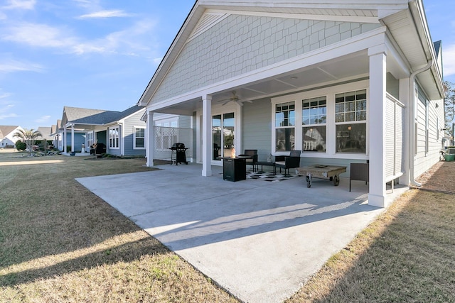 view of patio / terrace featuring a grill and a ceiling fan