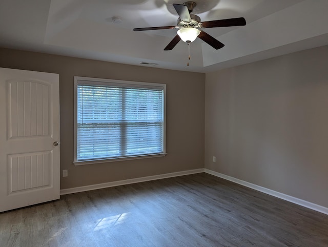 unfurnished room with hardwood / wood-style flooring and ceiling fan