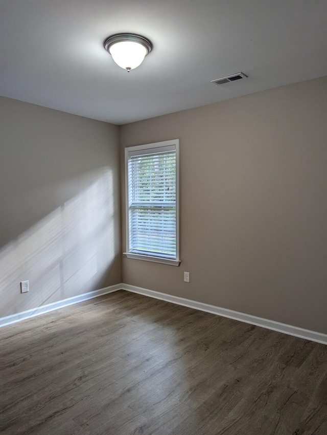 empty room featuring dark hardwood / wood-style floors