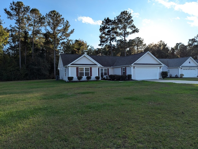 single story home with a garage and a front yard