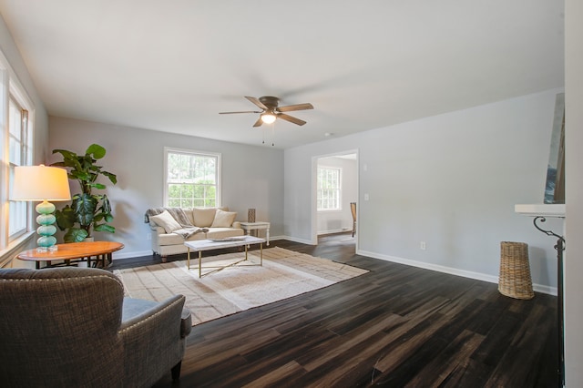 living room with ceiling fan and hardwood / wood-style floors