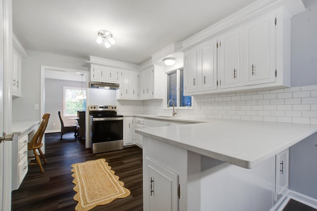 kitchen featuring dark wood-type flooring, tasteful backsplash, white cabinets, kitchen peninsula, and stainless steel electric range oven