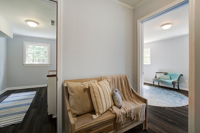 sitting room featuring crown molding and dark hardwood / wood-style flooring