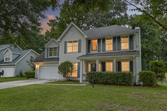 1616 Dotterers Run, Charleston, SC 29414 - traditional-style house with driveway, covered porch, a yard, and a shingled roof